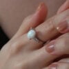 Oval Brilliant Engagement Opal Ring with Tapered Baguette Sidestones