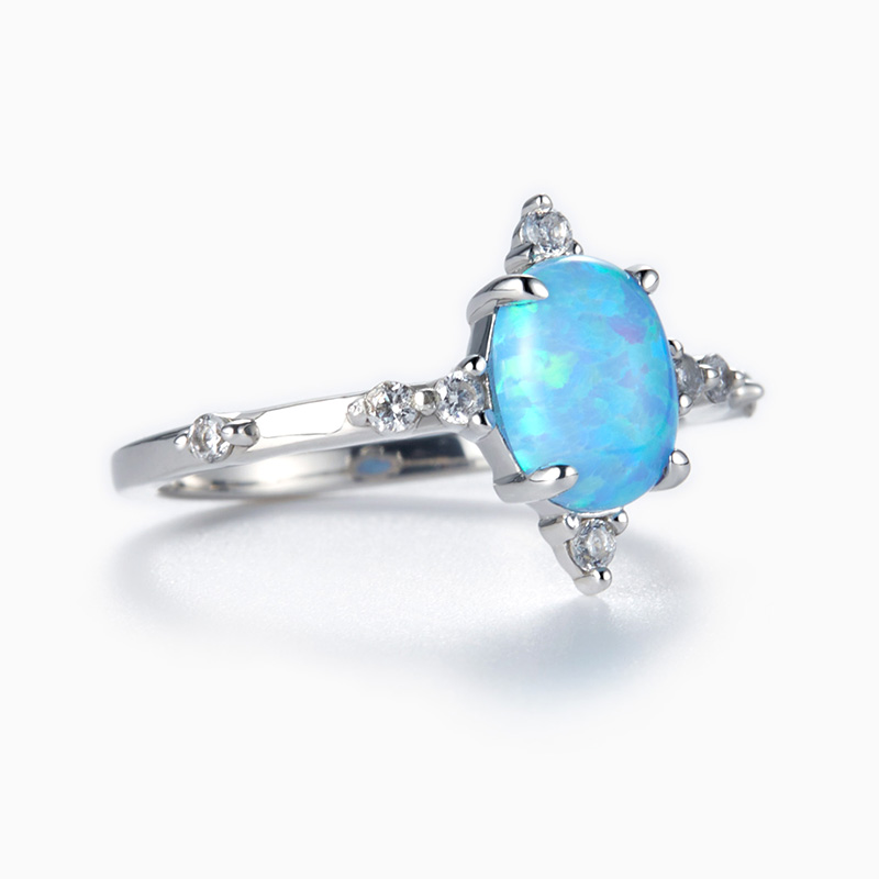 Oval Cut Opal Engagement Ring with Round Sidestones