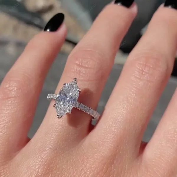 Lane Woods Marquise Shaped Halo Moissanite Engagement Ring With Pave